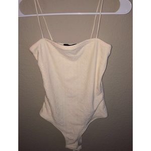 Yellow bodysuit. Brand Faded rose. Size small.